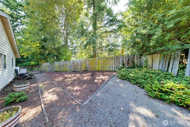 a view of backyard with small cabin