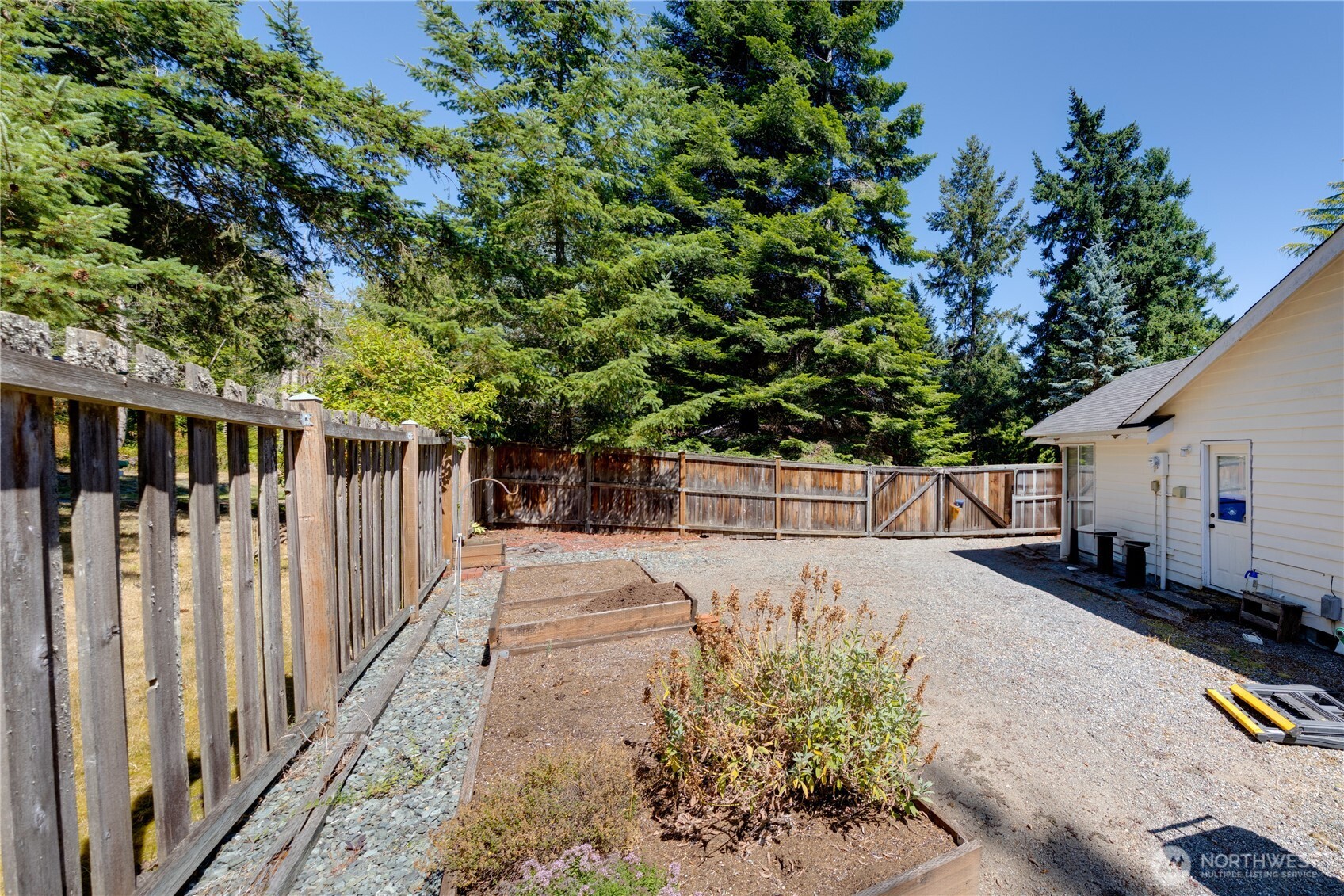 399 Tilingit Place La Conner, WA 98257 - Photo 31 of 39 a view of backyard with small cabin