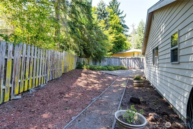 a view of a house with yard and a garden