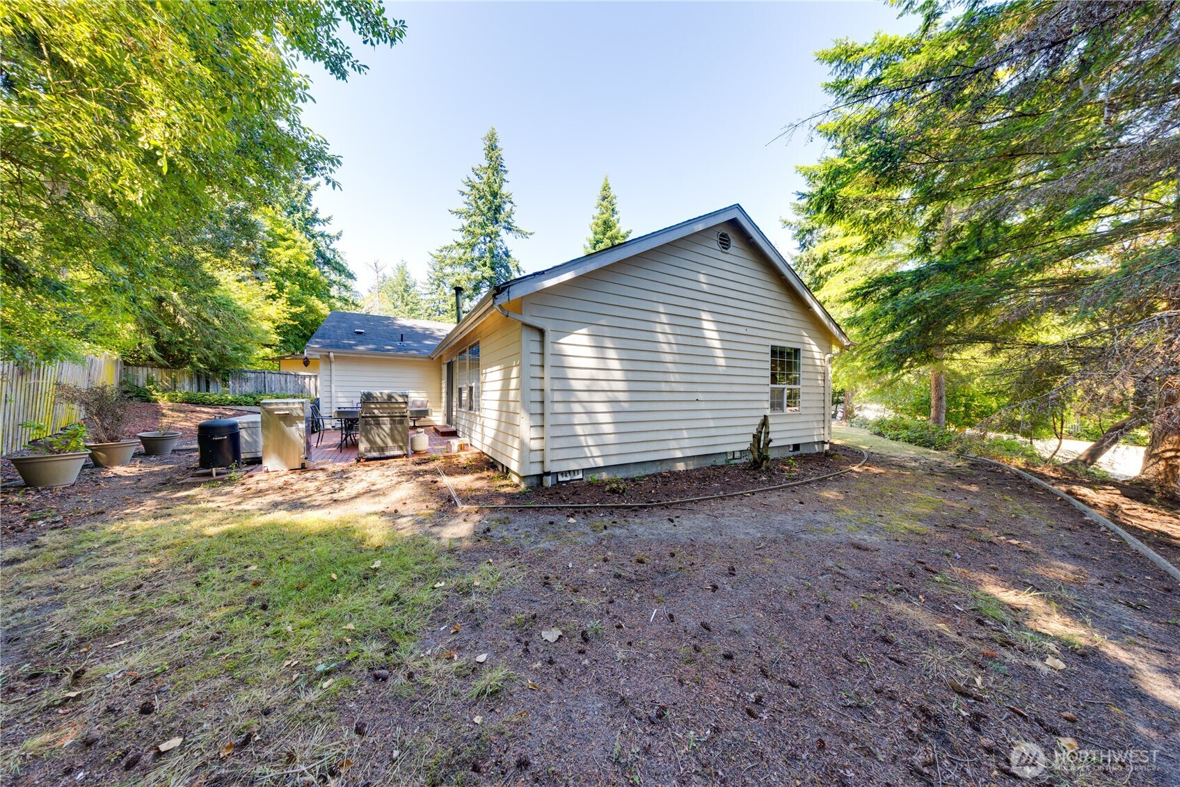 399 Tilingit Place La Conner, WA 98257 - Photo 34 of 39 a view of a house with backyard and sitting area