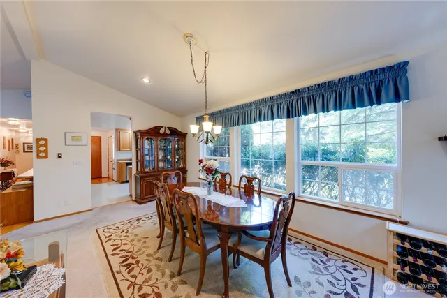 a view of a dining room with furniture window and outside view