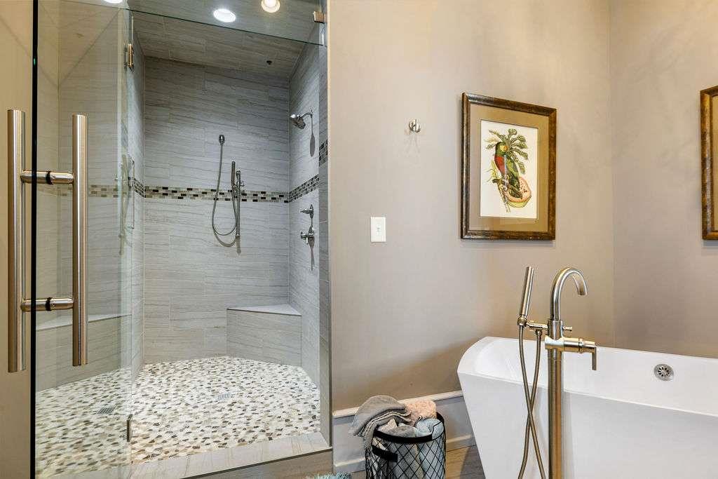 100 Broad Street Rome, GA 30161 - Photo 69 of 93 a bathroom with a tub and shower