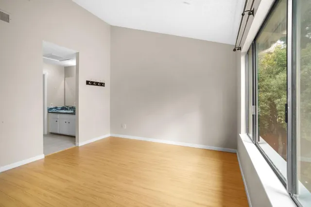 a view of an empty room with a window