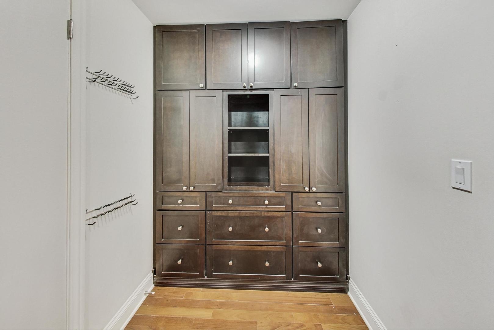 1040 North Lake Shore Drive, Unit 7B Chicago, IL 60611 - Photo 26 of 45 a view of wooden cabinets