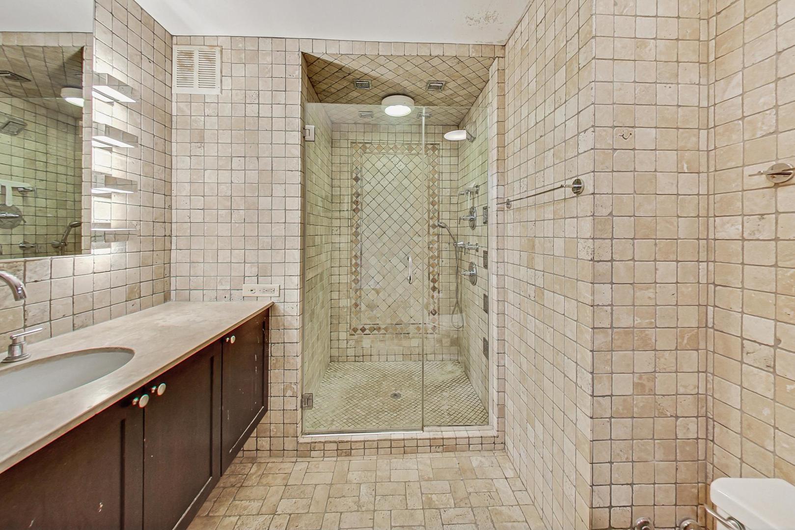 1040 North Lake Shore Drive, Unit 7B Chicago, IL 60611 - Photo 28 of 45 a bathroom with a shower