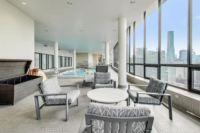 a living room with furniture and a dining table