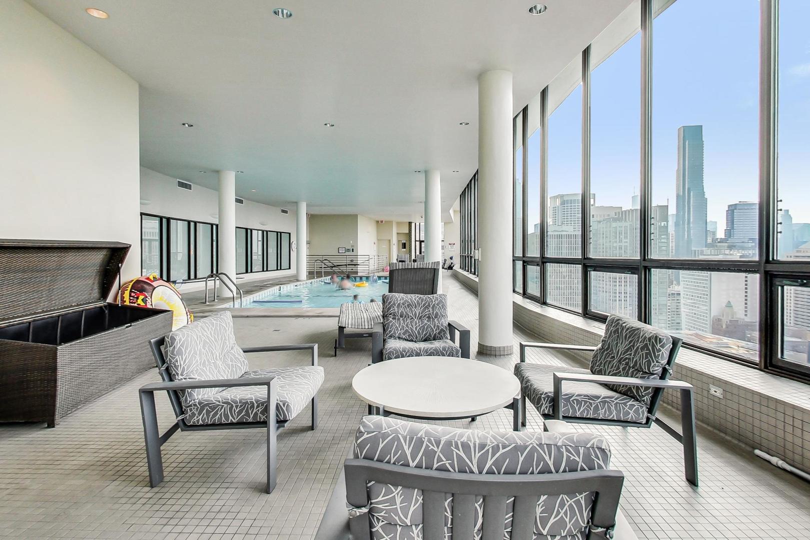 1040 North Lake Shore Drive, Unit 7B Chicago, IL 60611 - Photo 37 of 45 a living room with furniture and a dining table