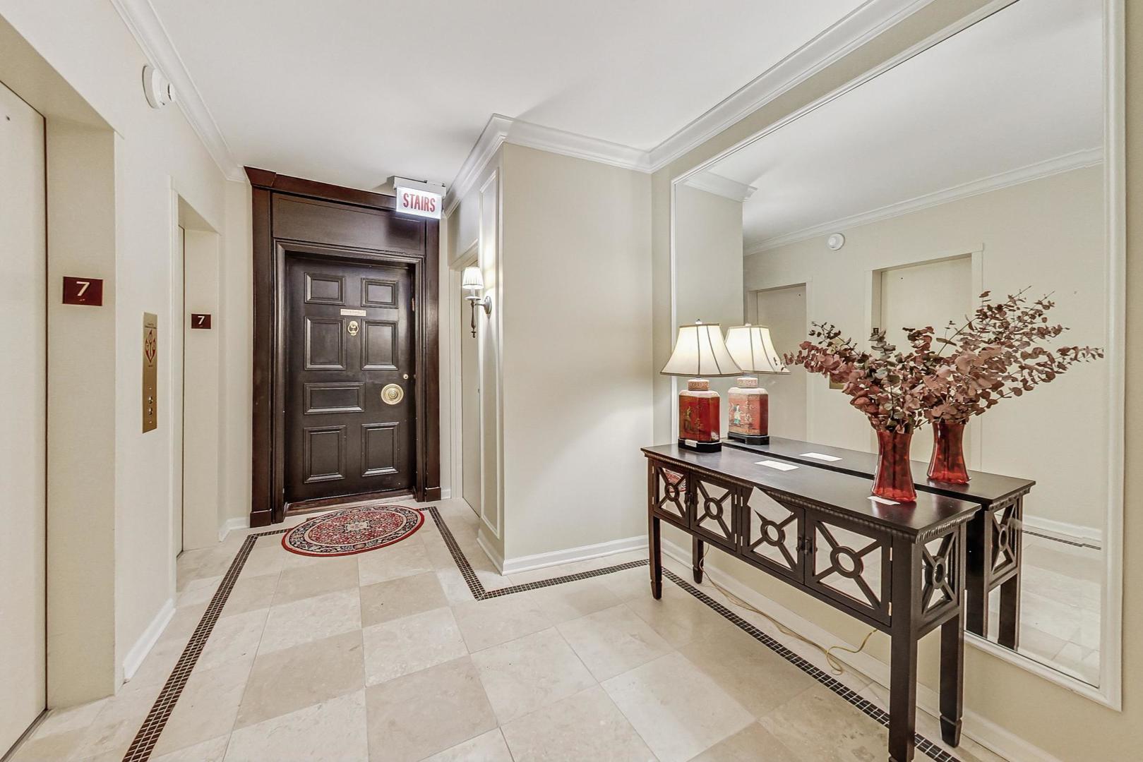 1040 North Lake Shore Drive, Unit 7B Chicago, IL 60611 - Photo 4 of 45 a view of a hallway to a livingroom and a furniture