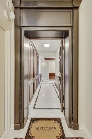 a view of a hallway with staircase
