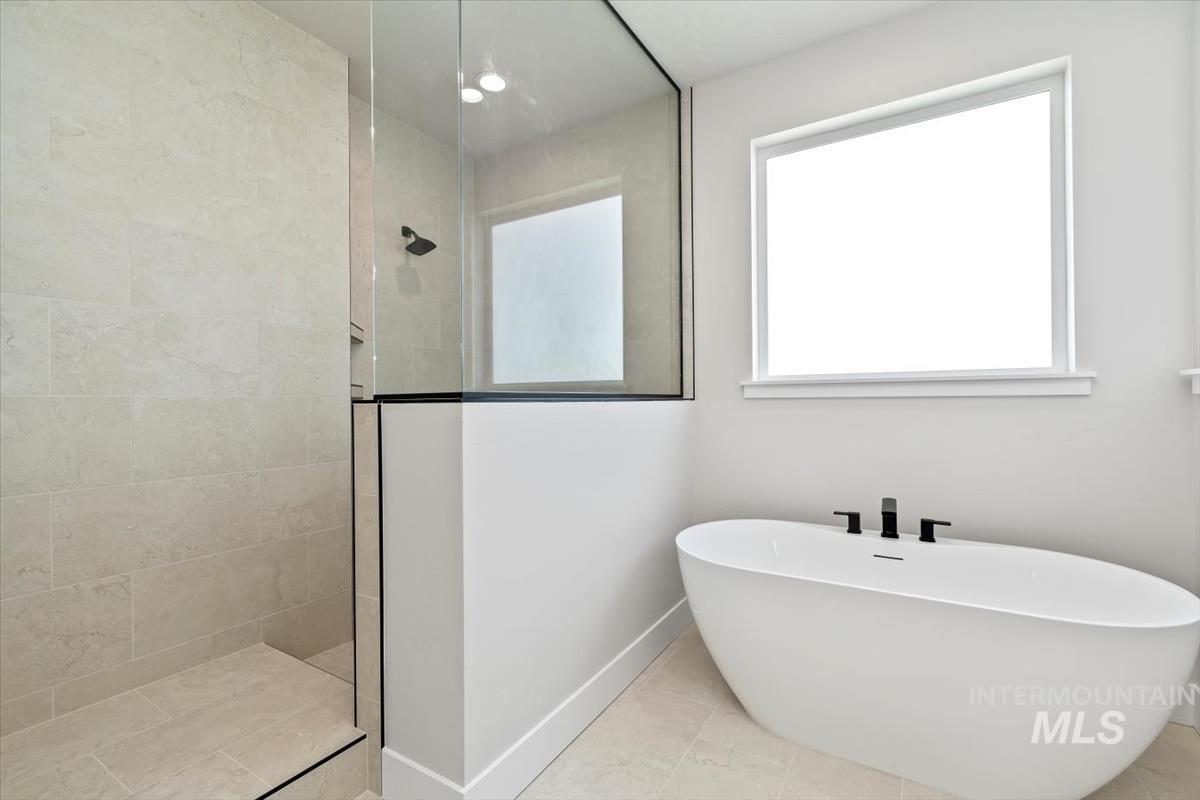 2830 West Jutland Street Meridian, ID 83642 - Photo 24 of 40 Full bath featuring walk in shower, a freestanding bath, tile patterned floors, and recessed lighting