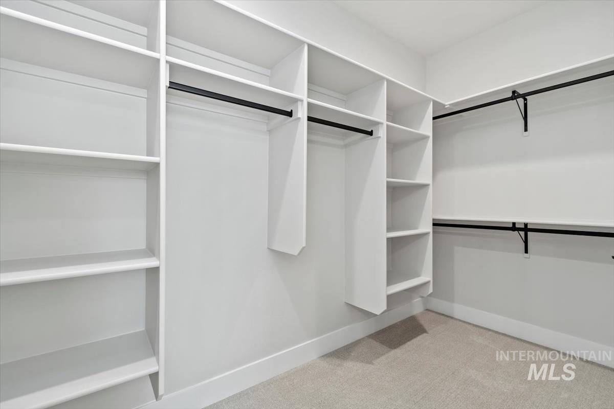 2830 West Jutland Street Meridian, ID 83642 - Photo 27 of 40 Walk in closet featuring light colored carpet
