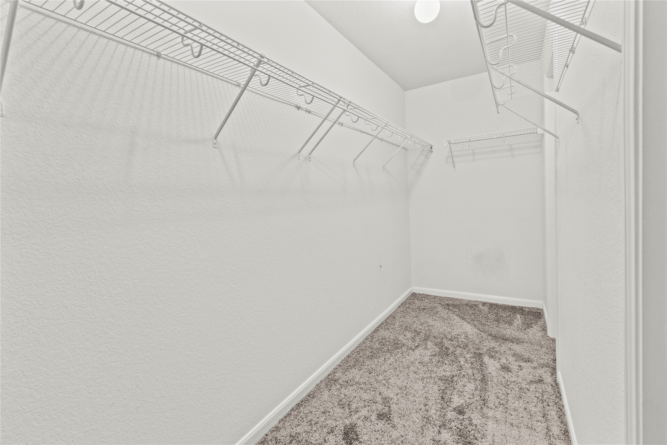 7922 Owl Lane Baytown, TX 77523 - Photo 11 of 25 a view of a room with racks on the wall