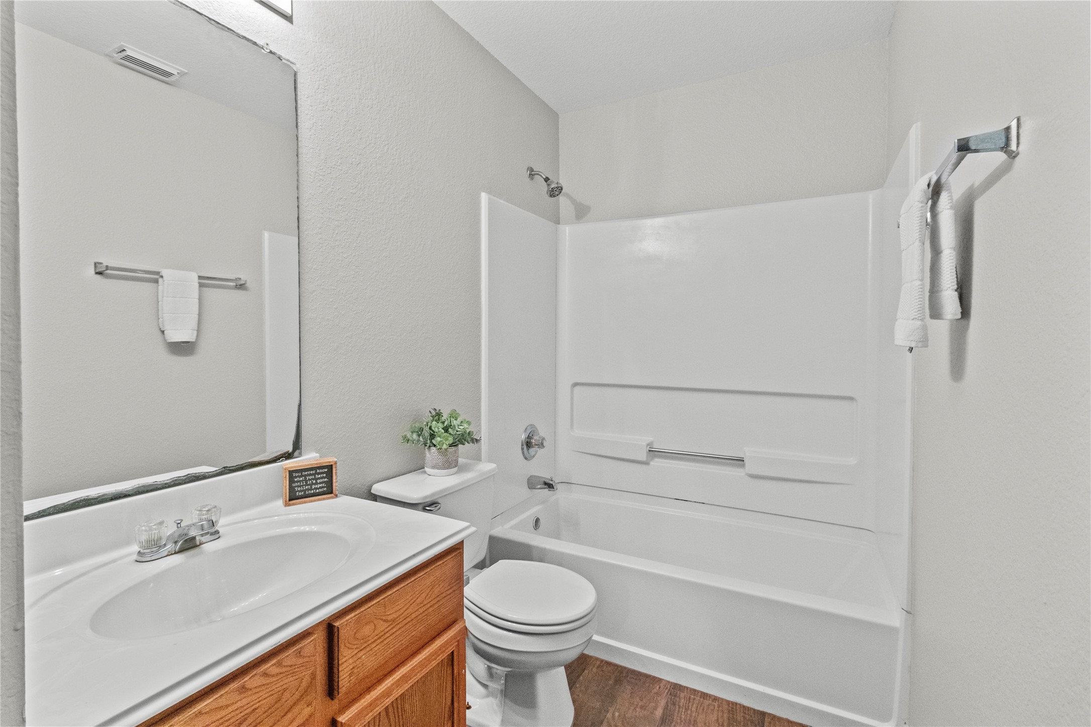 7922 Owl Lane Baytown, TX 77523 - Photo 14 of 25 a bathroom with a sink a toilet and shower