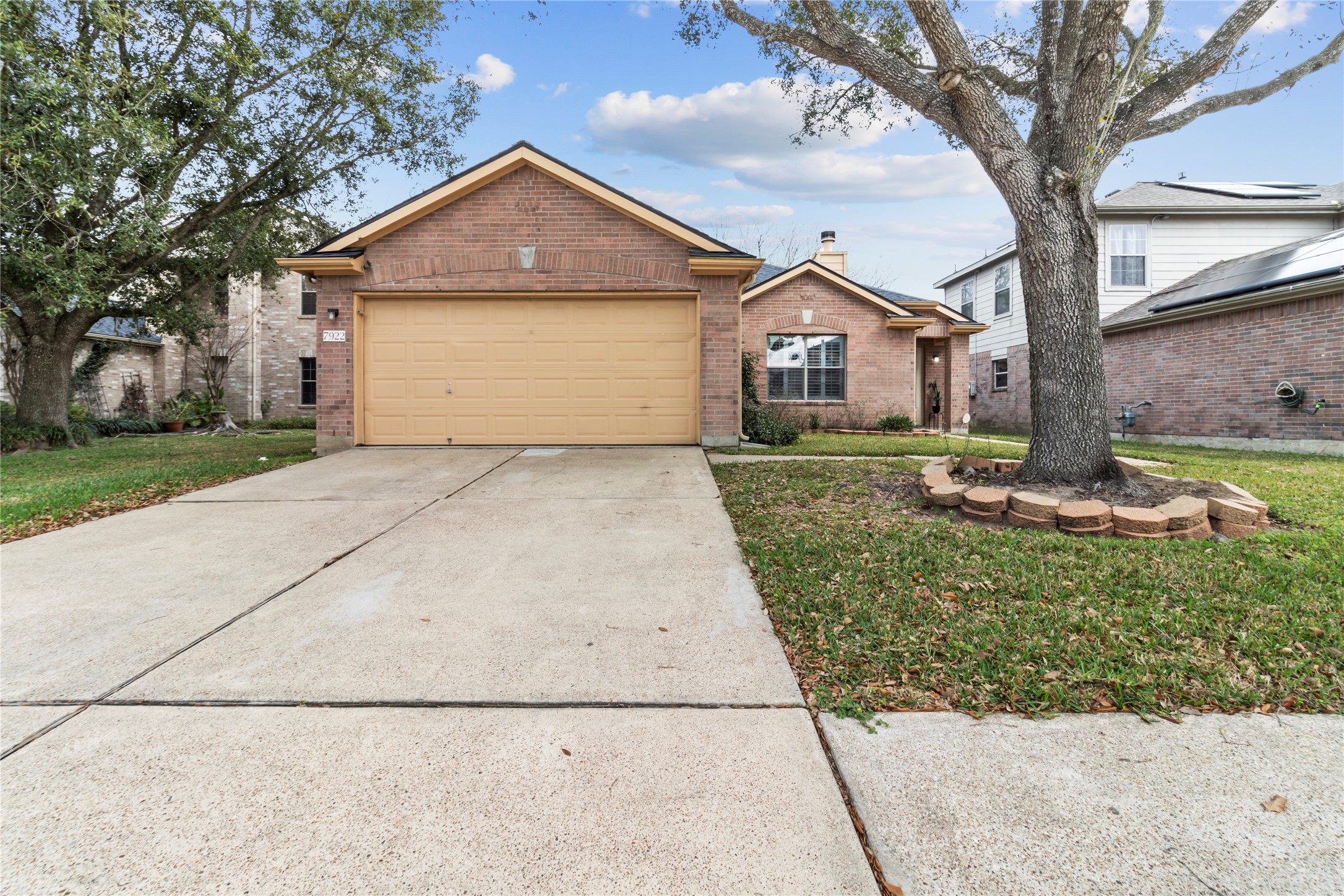 7922 Owl Lane Baytown, TX 77523 - Photo 20 of 25 a front view of a house with a yard and garage