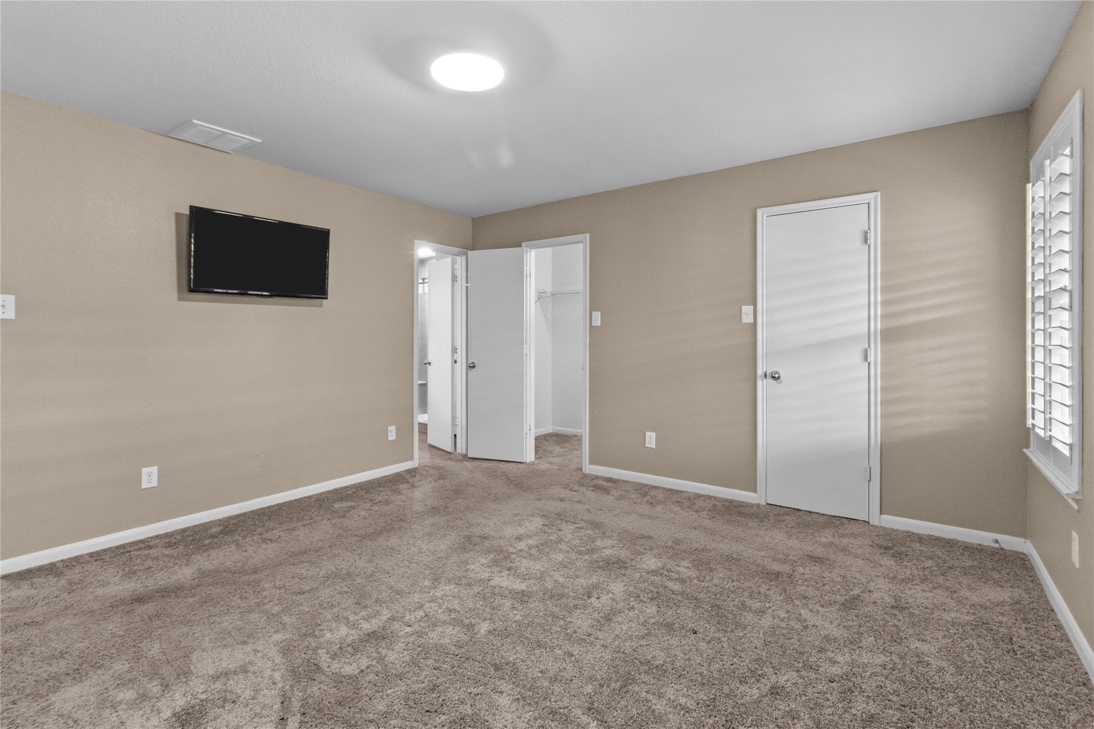 7922 Owl Lane Baytown, TX 77523 - Photo 9 of 25 an empty room with windows and fireplace