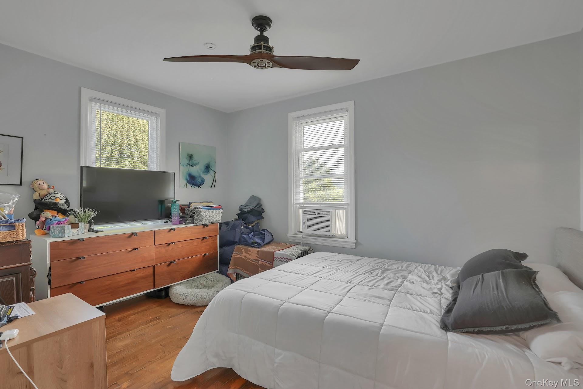 71 Greycourt Road Chester, NY 10918 - Photo 16 of 38 Bedroom with dark wood-type flooring, multiple windows, and ceiling fan