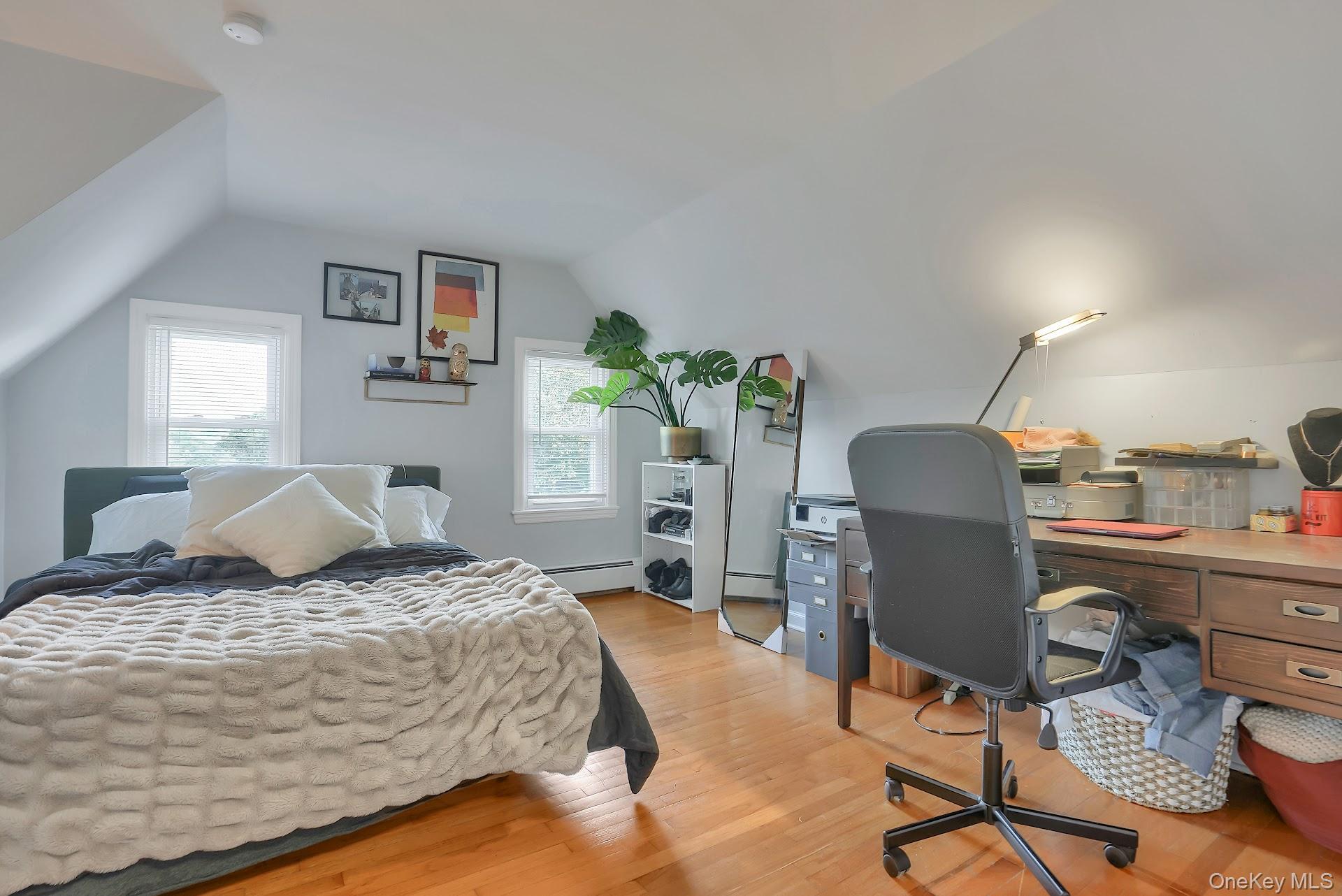 71 Greycourt Road Chester, NY 10918 - Photo 23 of 38 Bedroom with an office area, light wood-style flooring, vaulted ceiling, and a baseboard radiator