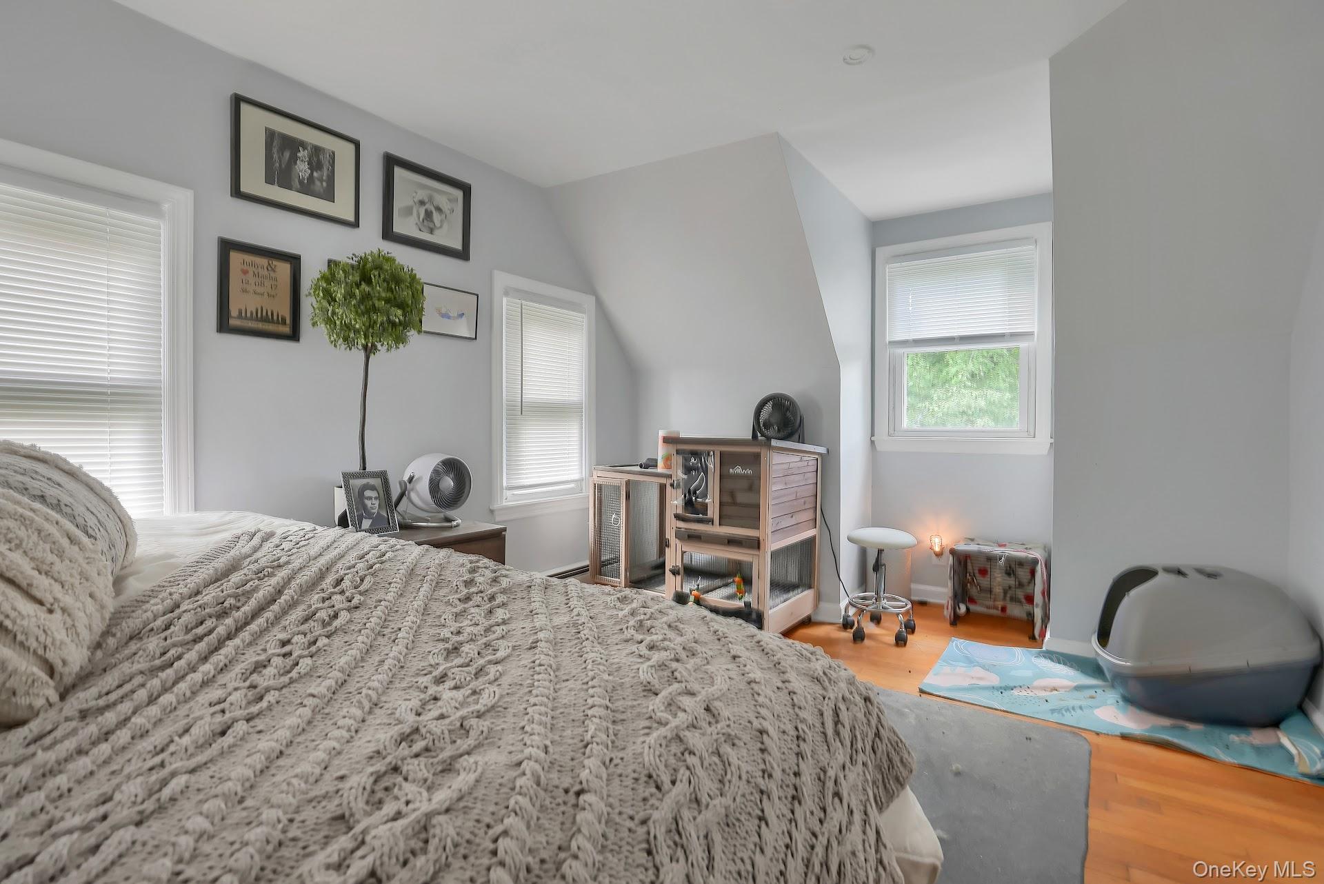 71 Greycourt Road Chester, NY 10918 - Photo 27 of 38 Bedroom featuring light wood finished floors, multiple windows, and vaulted ceiling