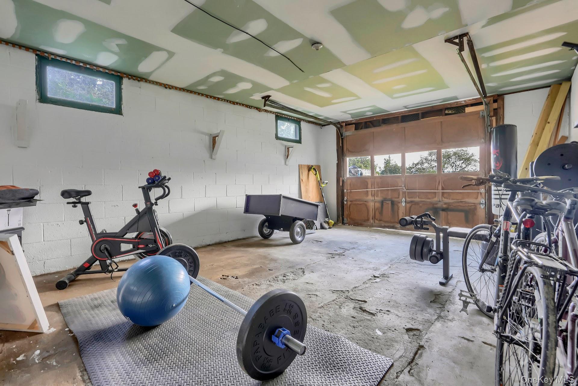 71 Greycourt Road Chester, NY 10918 - Photo 31 of 38 Workout area featuring plenty of natural light, concrete block wall, concrete floors, and a garage