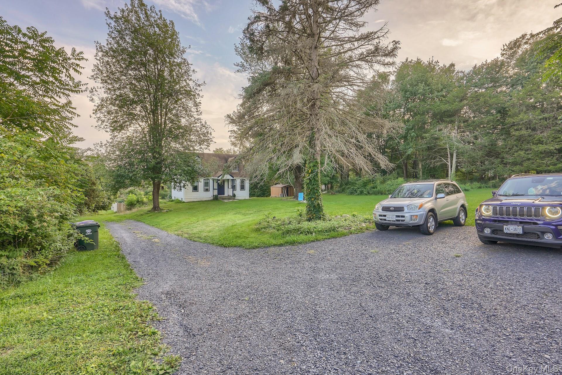 71 Greycourt Road Chester, NY 10918 - Photo 4 of 38 View of front of house featuring a lawn and gravel driveway