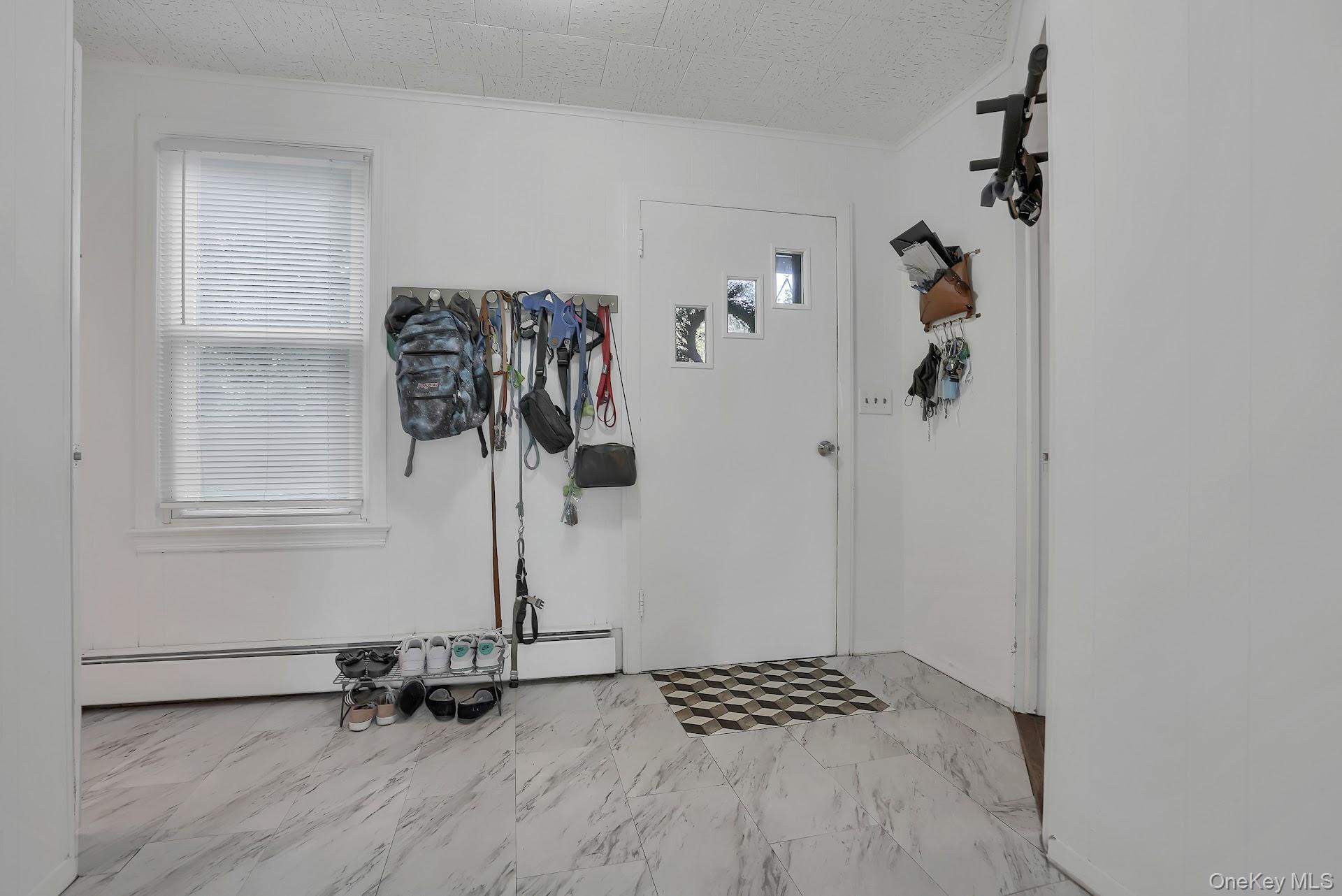 71 Greycourt Road Chester, NY 10918 - Photo 9 of 38 Foyer featuring crown molding and a baseboard heating unit
