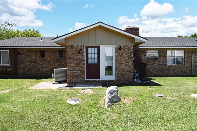 107903 South 4570 Road Sallisaw, OK 74955 - Photo 6 of 35 Brick exterior with gabled roofline and composition shingles