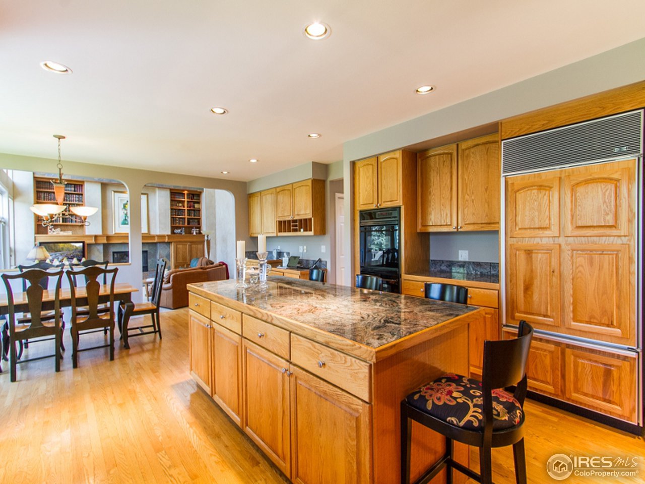 2512 Premier Place Boulder, CO 80304 - Photo 13 of 25 a kitchen with a table chairs refrigerator and cabinets