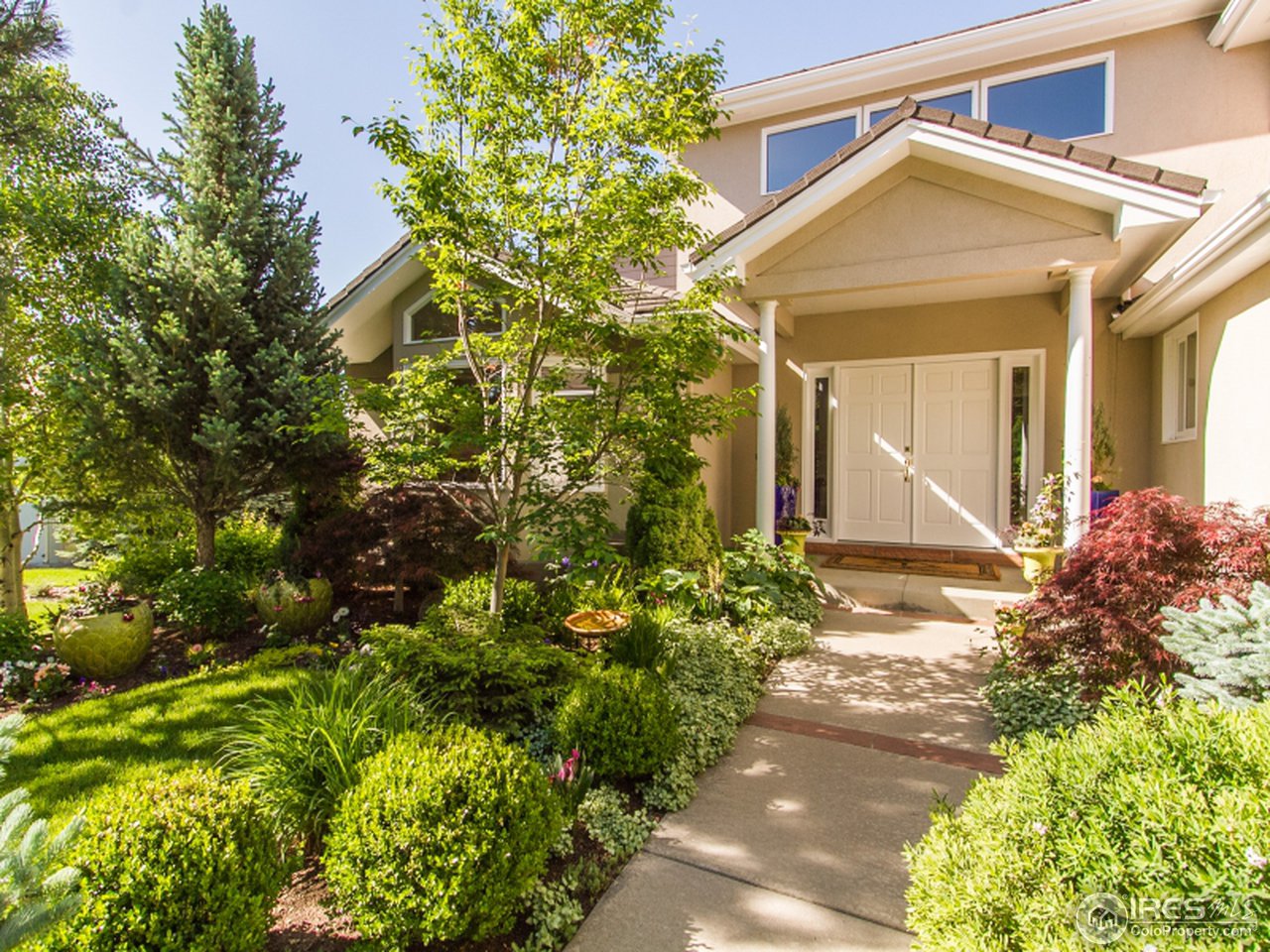 2512 Premier Place Boulder, CO 80304 - Photo 2 of 25 a view of a house with a flower garden