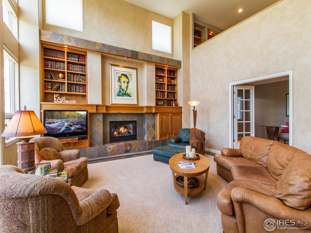 2512 Premier Place Boulder, CO 80304 - Photo 10 of 25 a living room with furniture and a fireplace