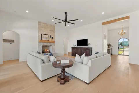 a large kitchen with a table and chairs