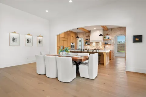 a kitchen with stainless steel appliances kitchen island granite countertop a sink and cabinets