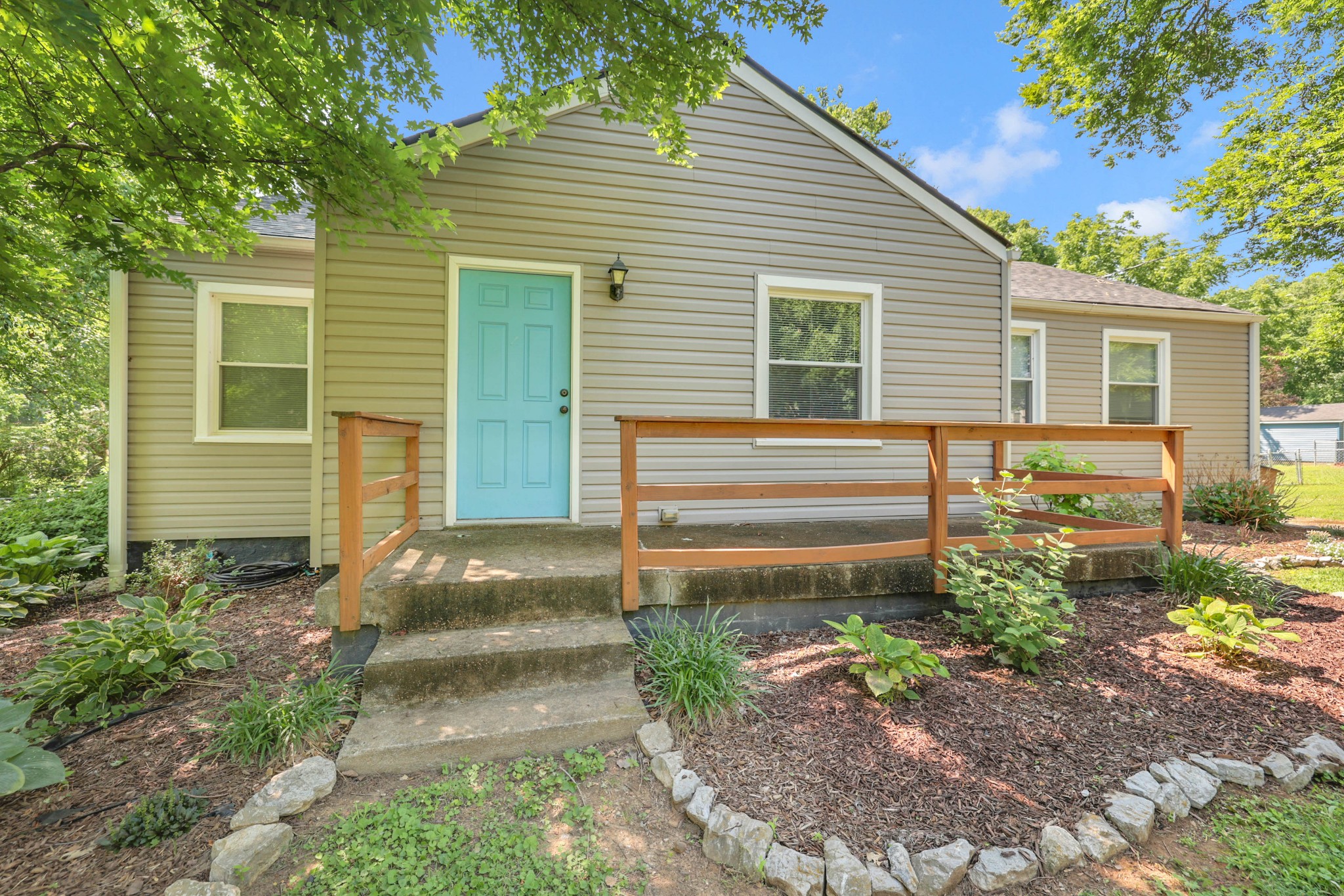 a front view of a house with garden
