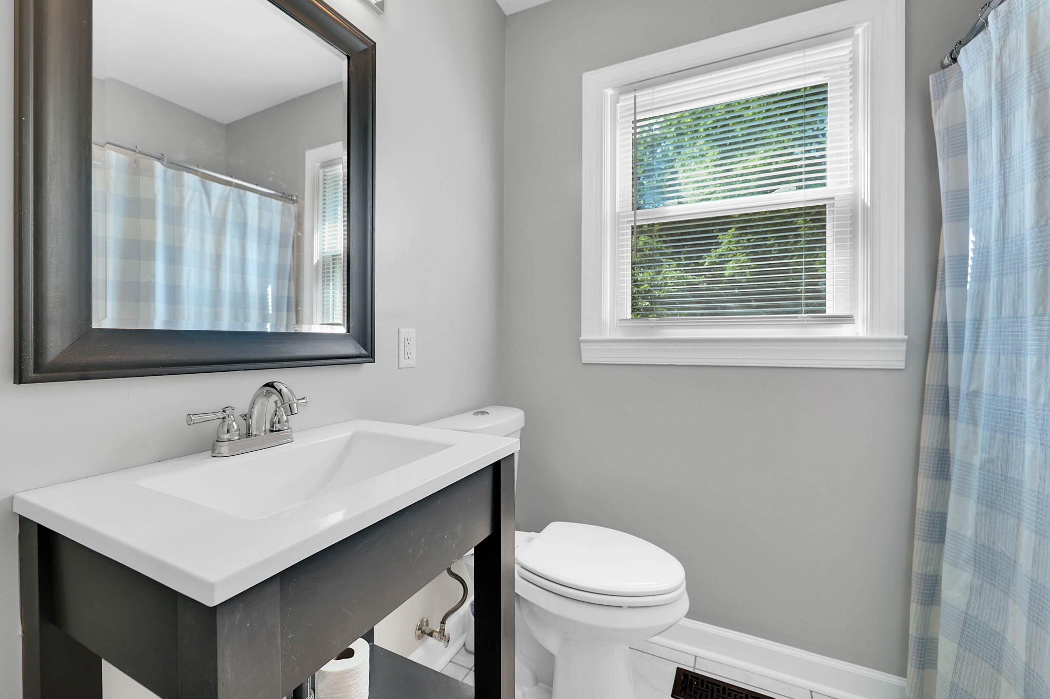 2812 Hastings Road Nashville, TN 37214 - Photo 19 of 32 a bathroom with a sink a toilet and a window
