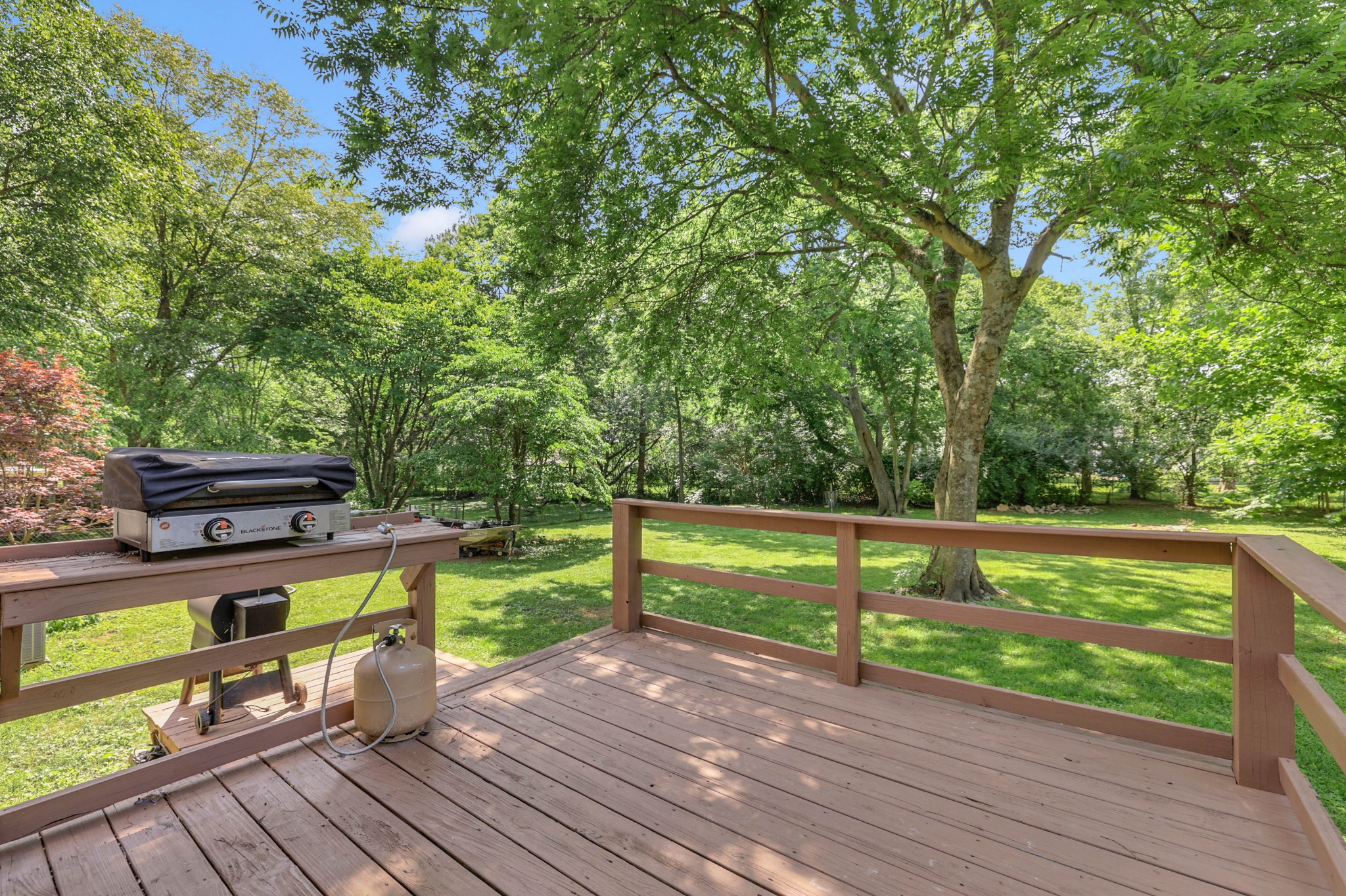 2812 Hastings Road Nashville, TN 37214 - Photo 26 of 32 a view of a deck with chairs a barbeque with wooden floor and fence