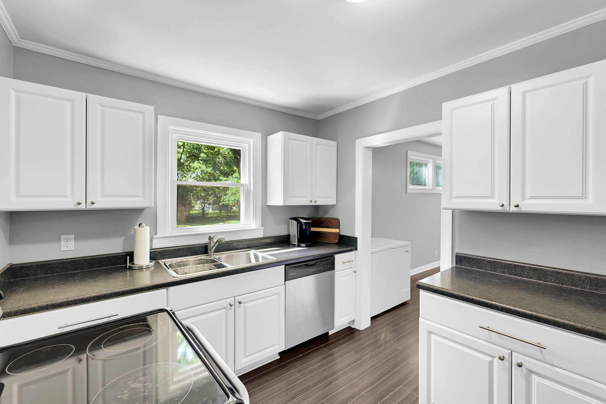 2812 Hastings Road Nashville, TN 37214 - Photo 8 of 32 a kitchen with granite countertop white cabinets and white appliances
