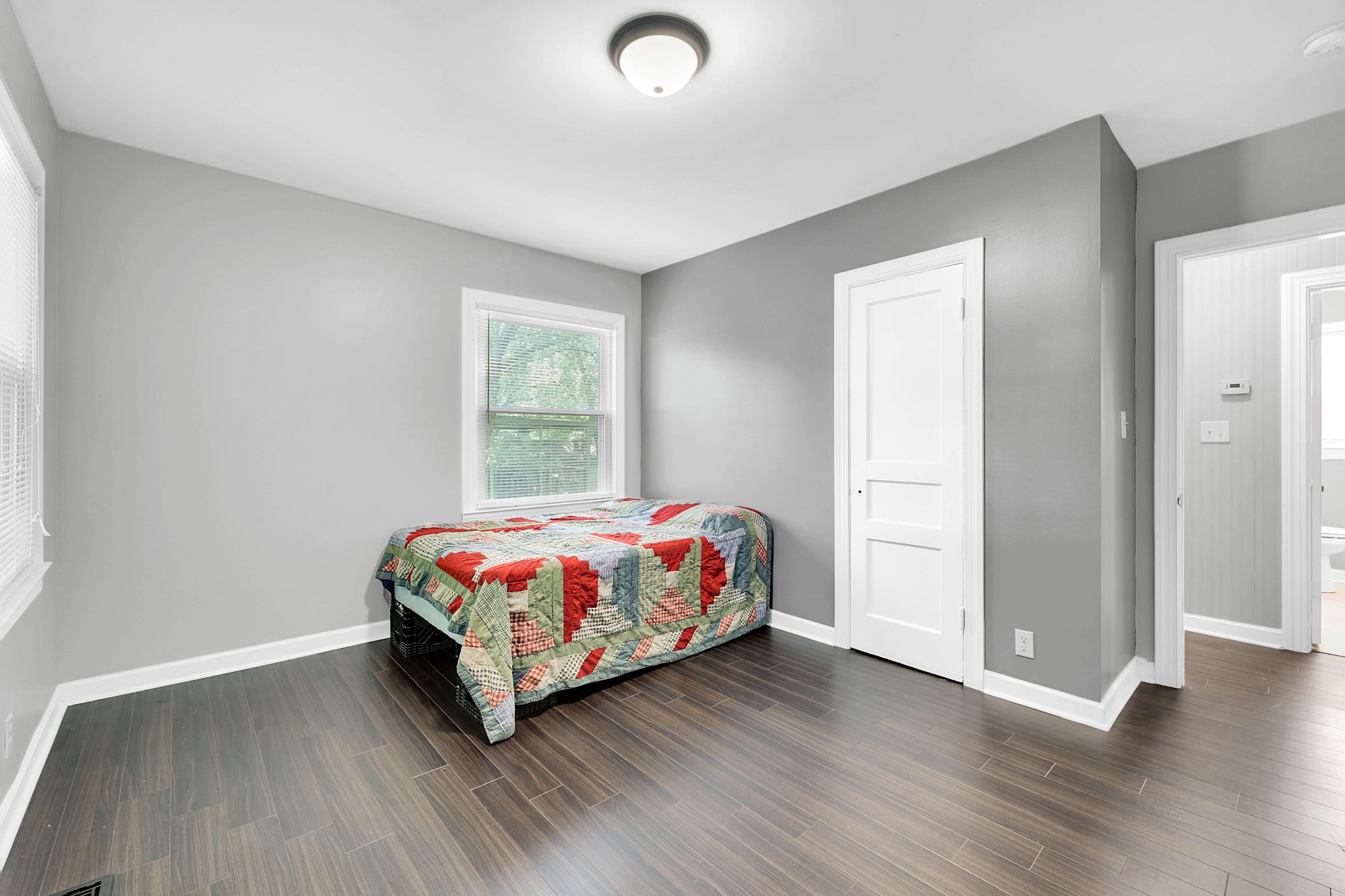 2812 Hastings Road Nashville, TN 37214 - Photo 10 of 32 a bedroom with a bed and wooden floor
