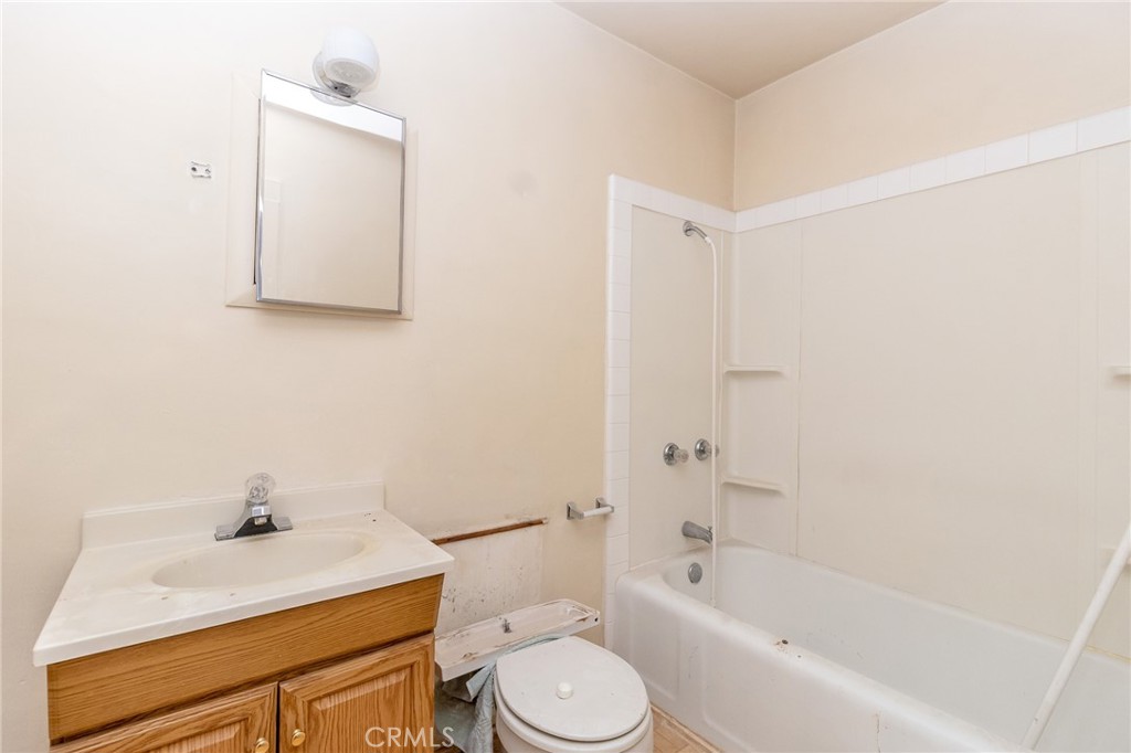 630 Acoma Street Needles, CA 92363 - Photo 54 of 60 a bathroom with a sink a toilet and shower