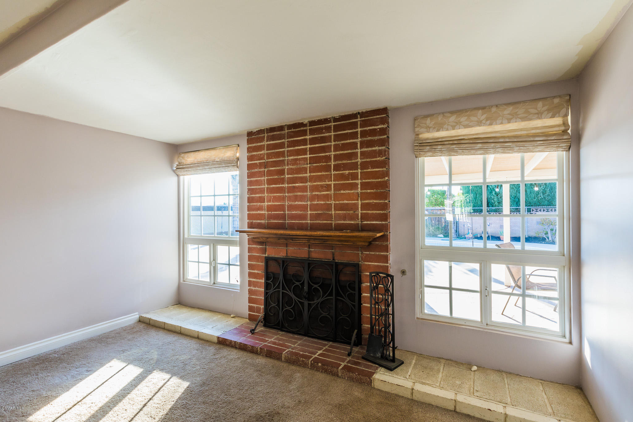 3441 Corpus Christi Street Simi Valley, CA 93063 - Photo 15 of 64 a view of an empty room with a fireplace and a window