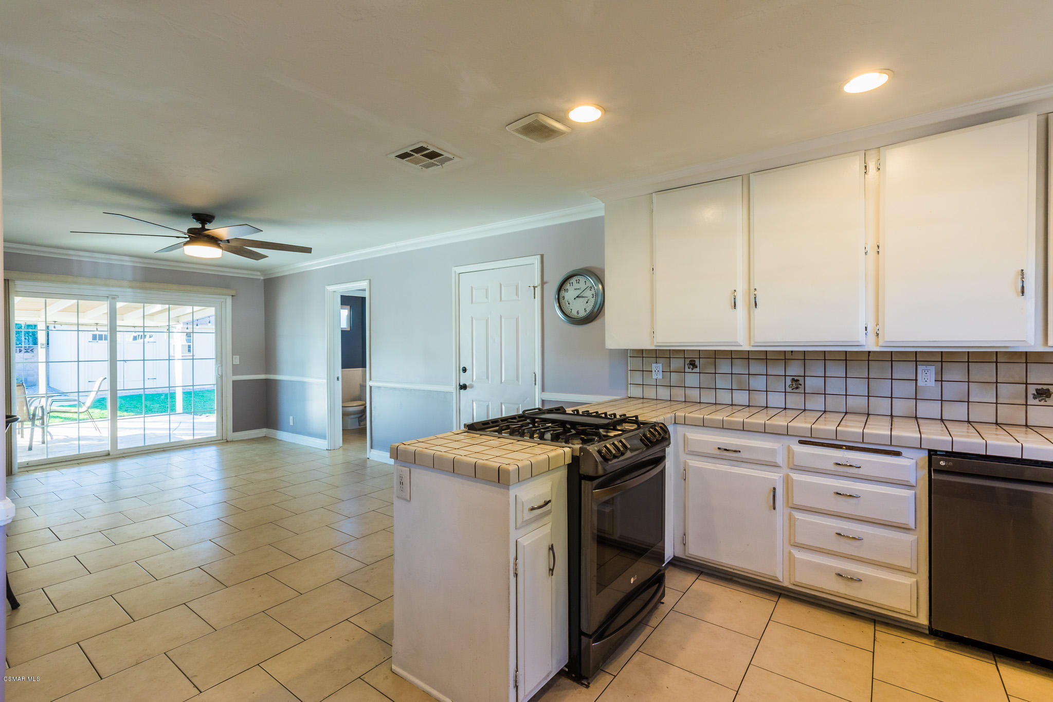 3441 Corpus Christi Street Simi Valley, CA 93063 - Photo 24 of 64 a kitchen with a stove top oven sink and cabinets