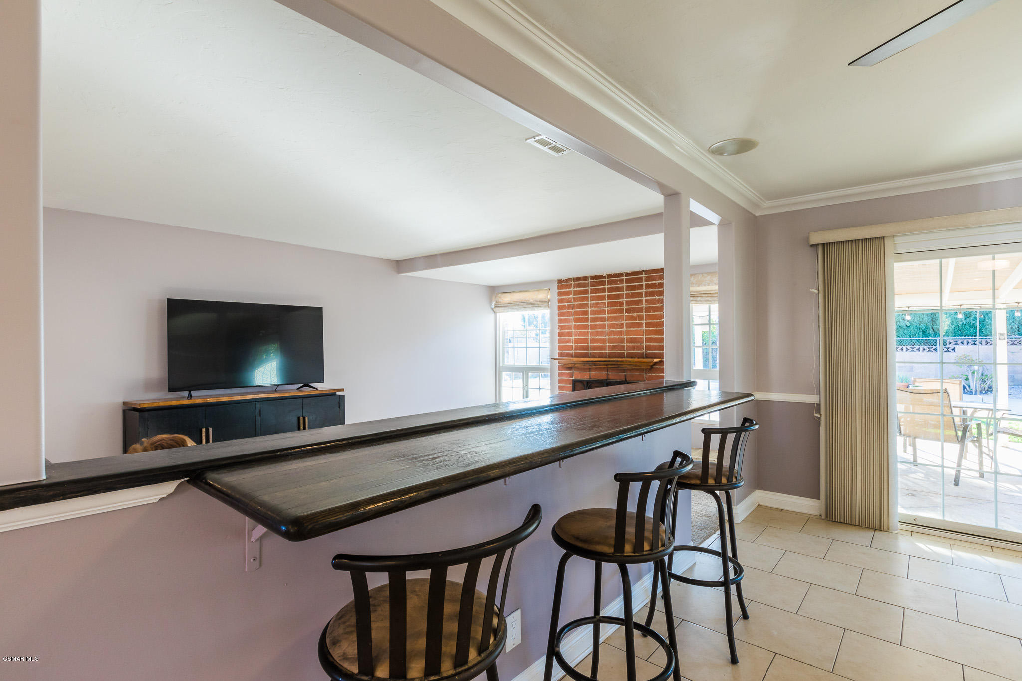3441 Corpus Christi Street Simi Valley, CA 93063 - Photo 29 of 64 a kitchen with a sink a counter and chairs in it