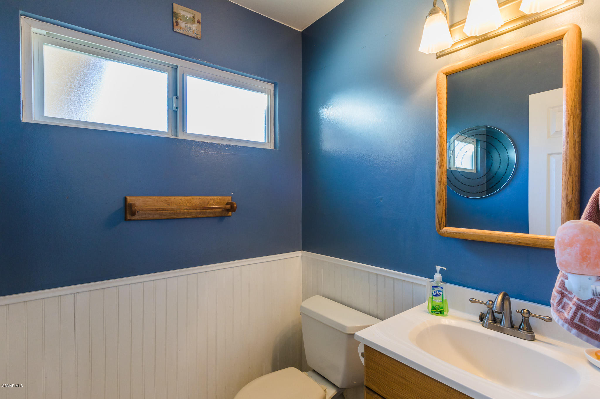 3441 Corpus Christi Street Simi Valley, CA 93063 - Photo 31 of 64 a bathroom with a sink a mirror and a toilet