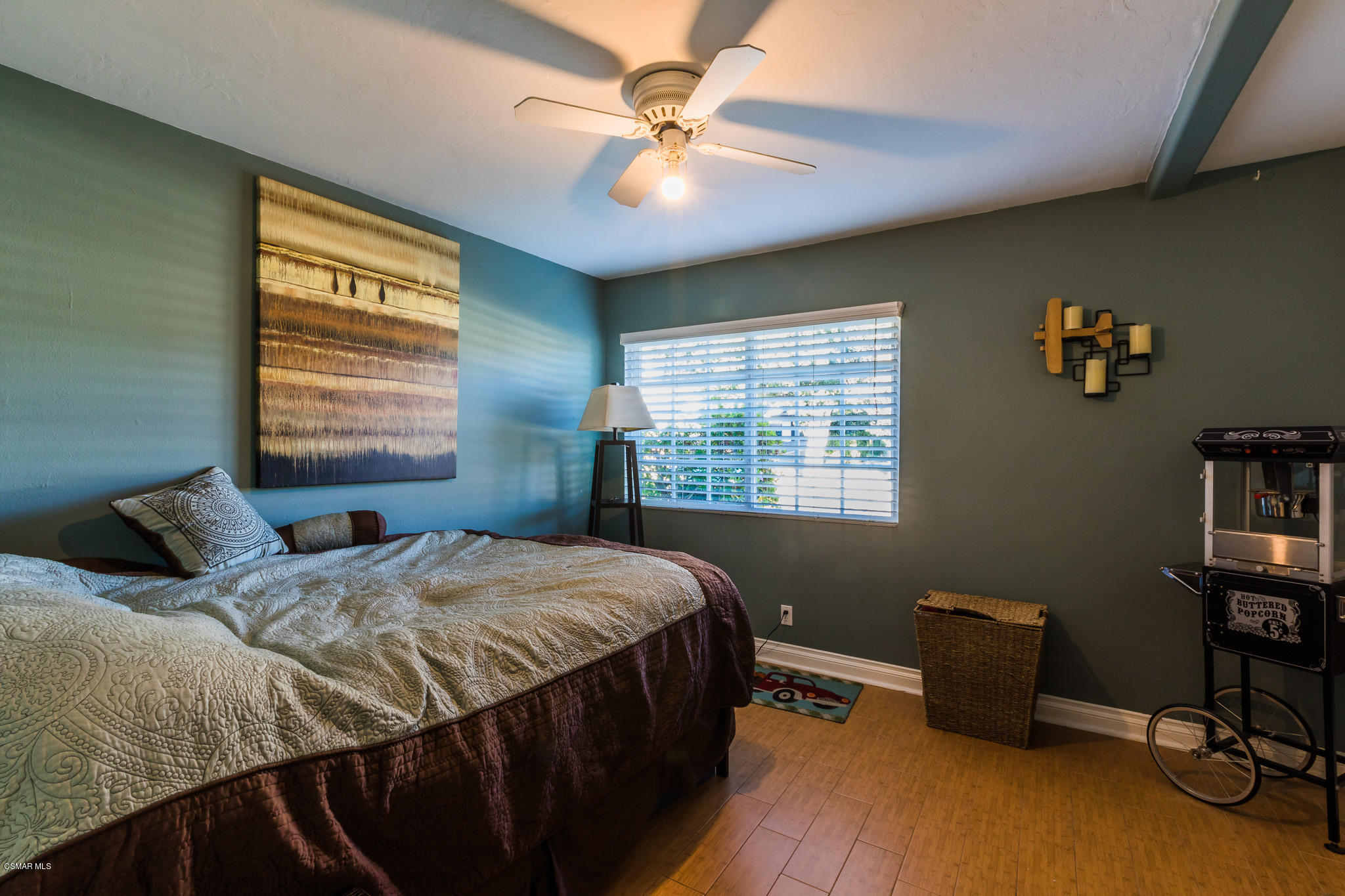 3441 Corpus Christi Street Simi Valley, CA 93063 - Photo 34 of 64 a bedroom with a bed and a chandelier