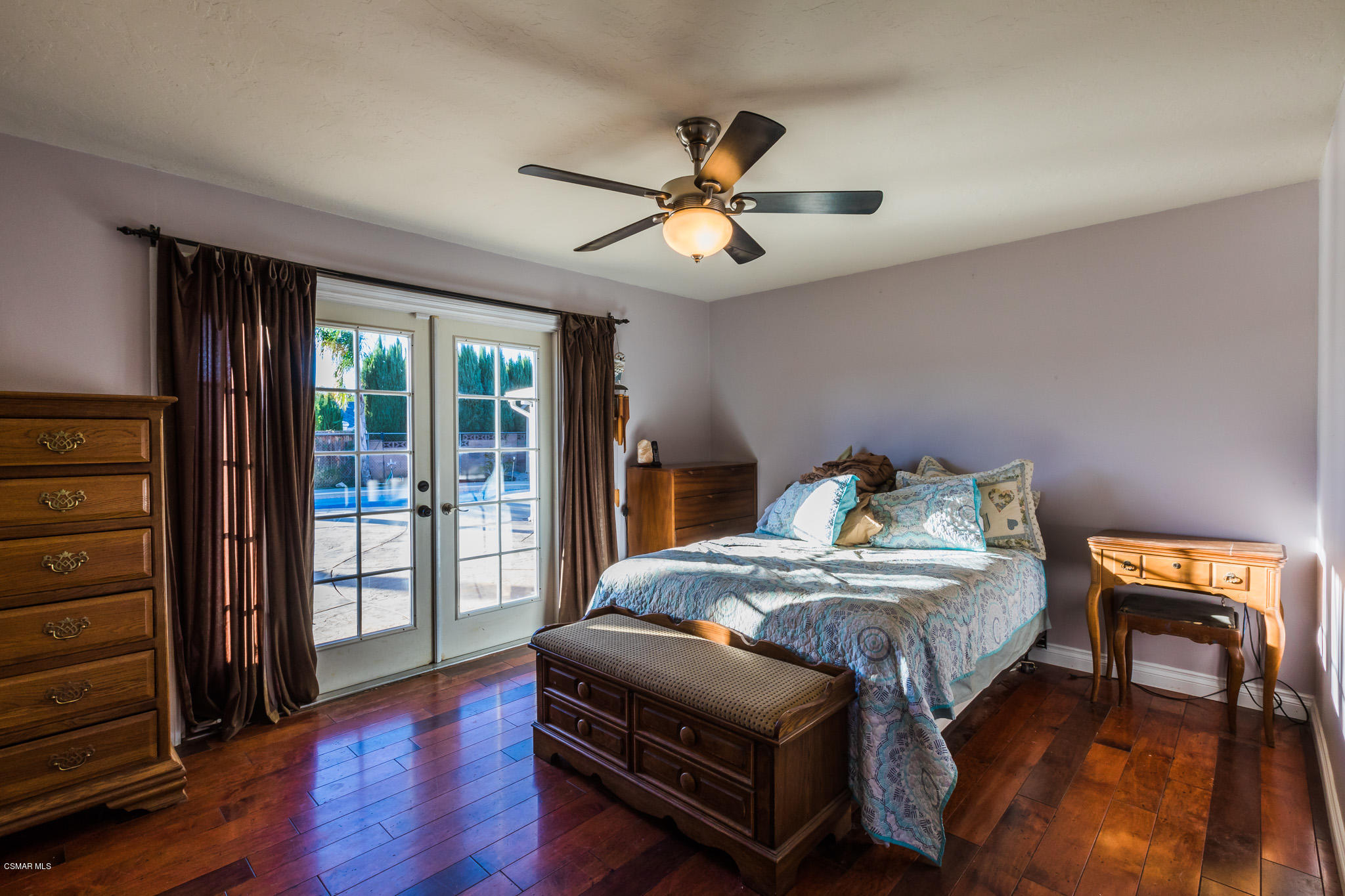 3441 Corpus Christi Street Simi Valley, CA 93063 - Photo 38 of 64 a bedroom with a bed and a chandelier