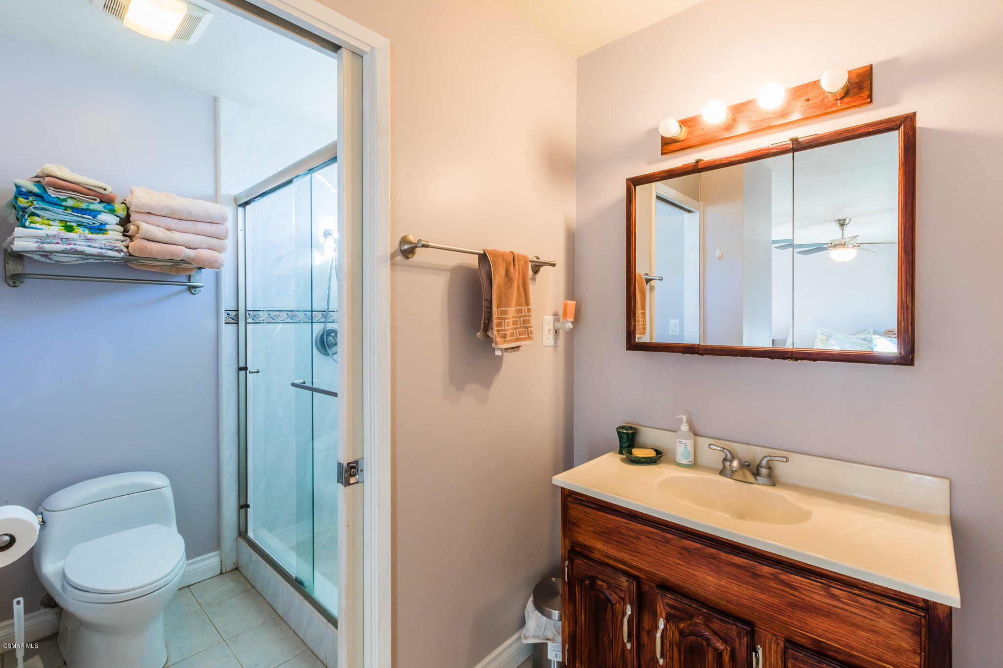 3441 Corpus Christi Street Simi Valley, CA 93063 - Photo 42 of 64 a bathroom with a sink and mirror with toilet