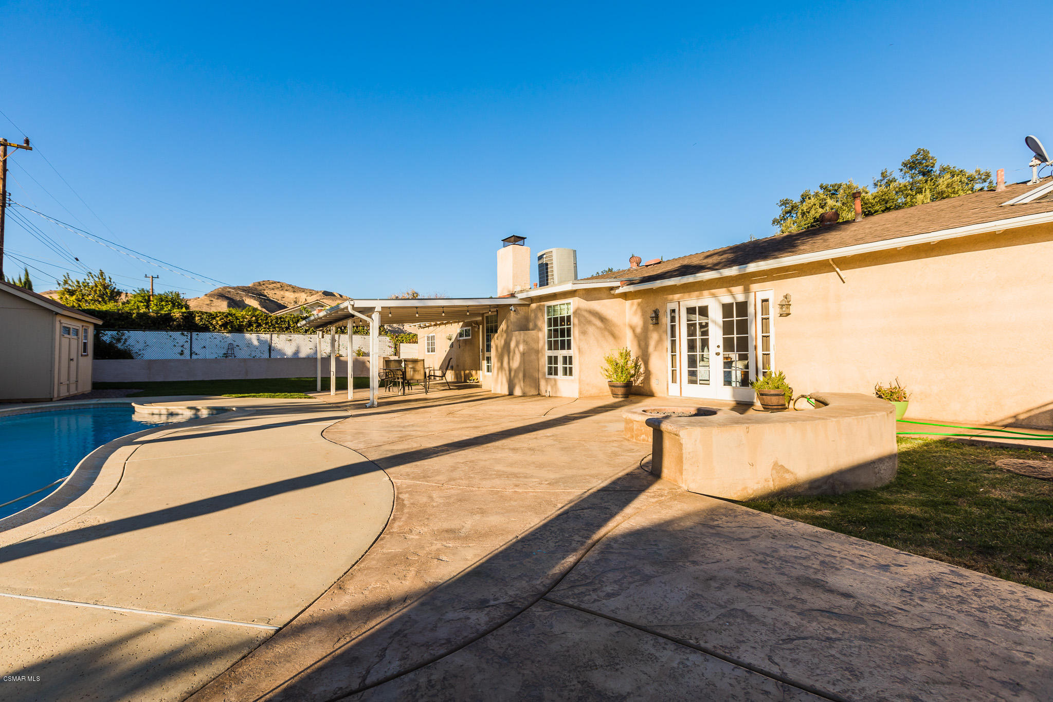 3441 Corpus Christi Street Simi Valley, CA 93063 - Photo 45 of 64 a view of a swimming pool with a lounge chairs
