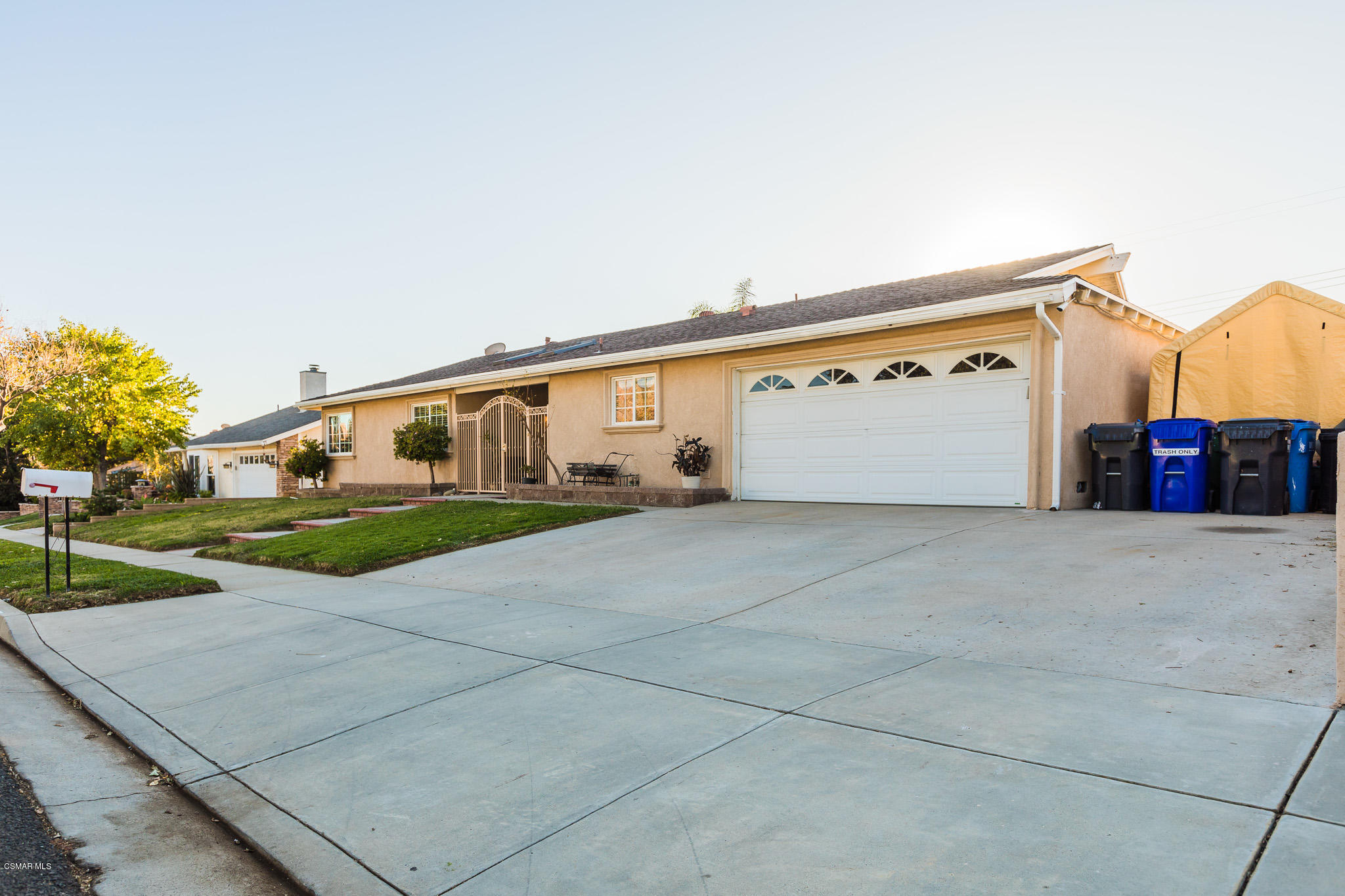 3441 Corpus Christi Street Simi Valley, CA 93063 - Photo 58 of 64 a view of a white house with a yard and plants