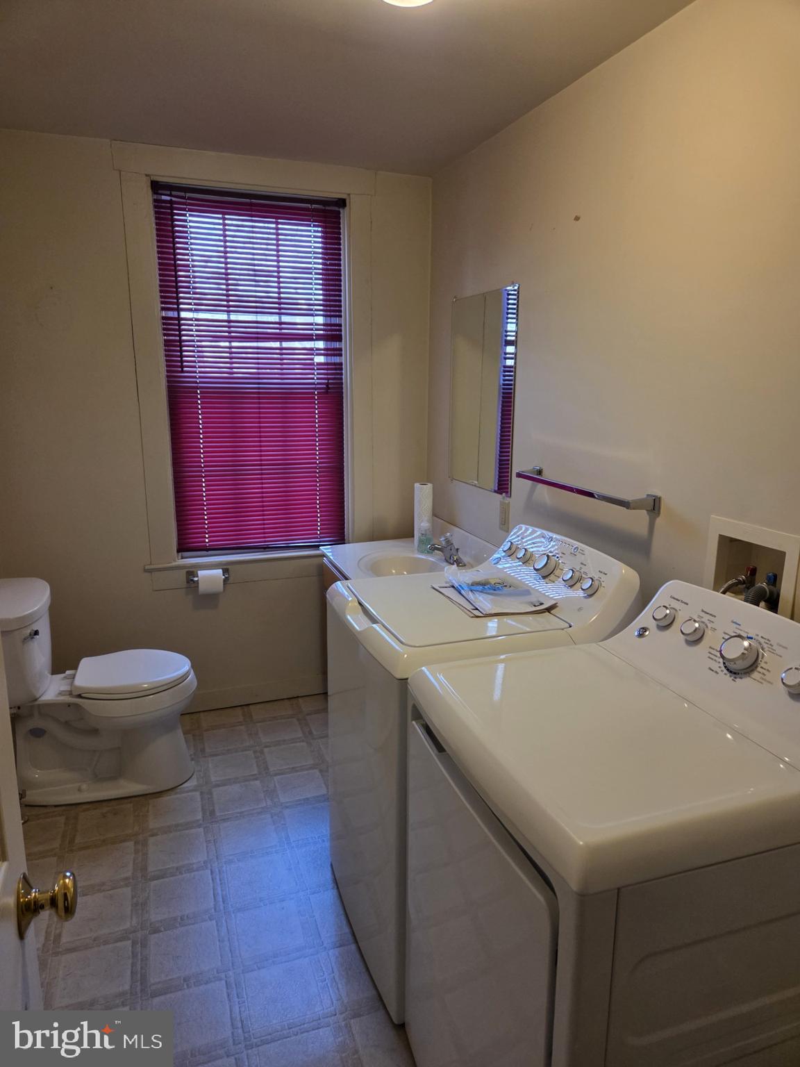 415 West King Street Lancaster, PA 17603 - Photo 18 of 18 a bathroom with a sink a toilet and a mirror