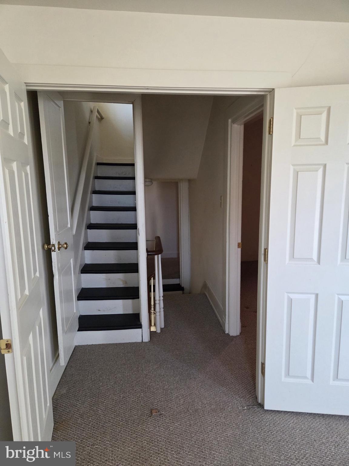 415 West King Street Lancaster, PA 17603 - Photo 5 of 18 a view of room with staircase and white door