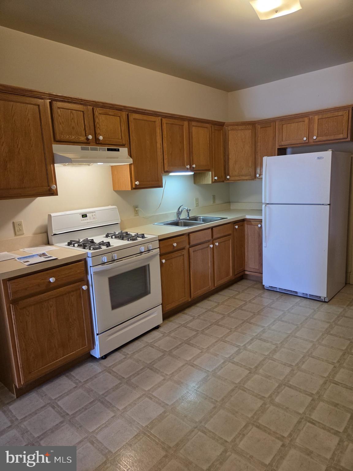 415 West King Street Lancaster, PA 17603 - Photo 6 of 18 a kitchen with stainless steel appliances granite countertop a stove a sink and a refrigerator