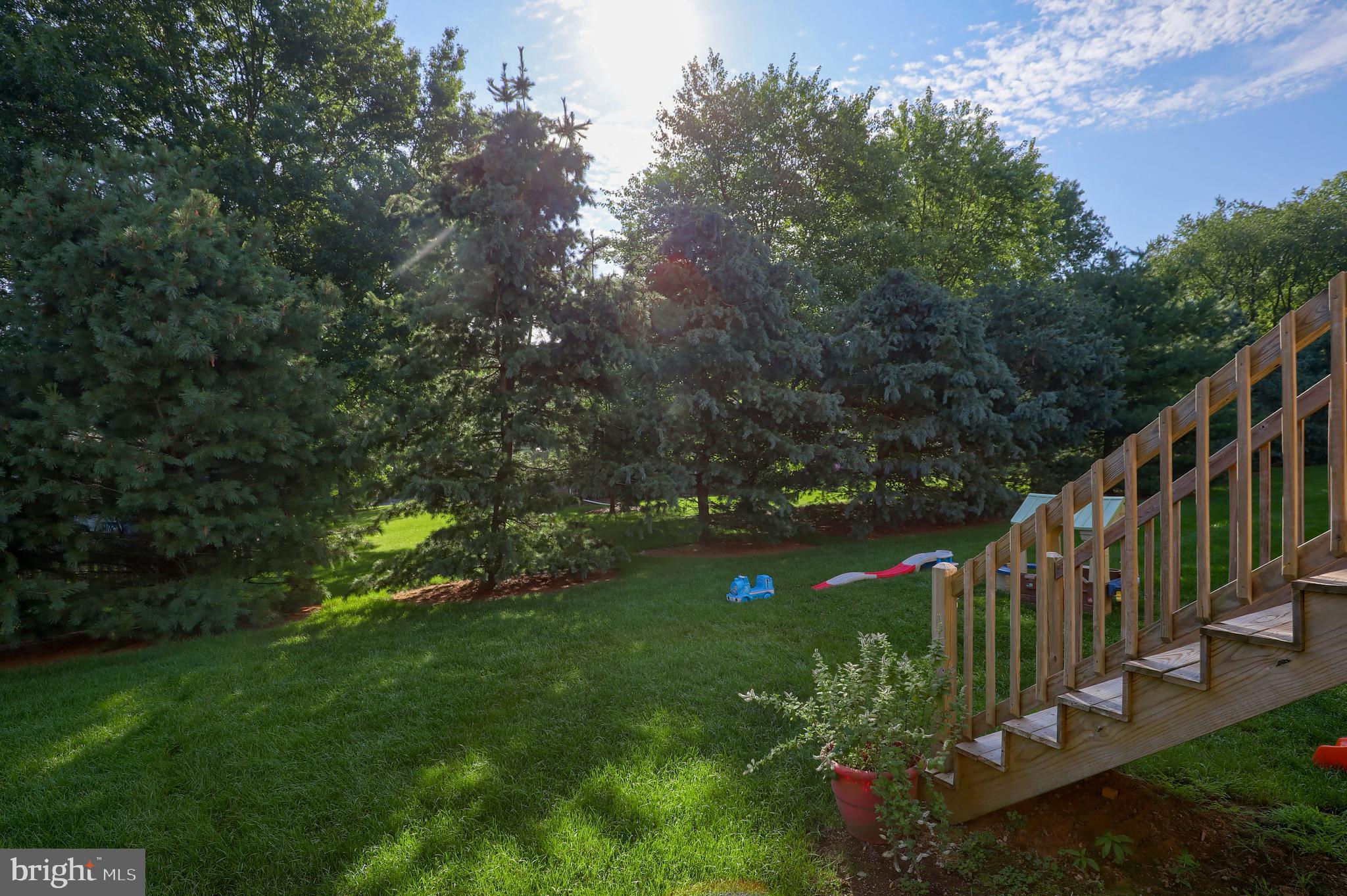 765 Keller Drive Lititz, PA 17543 - Photo 35 of 36 Stairs from deck to common area such a pretty area
